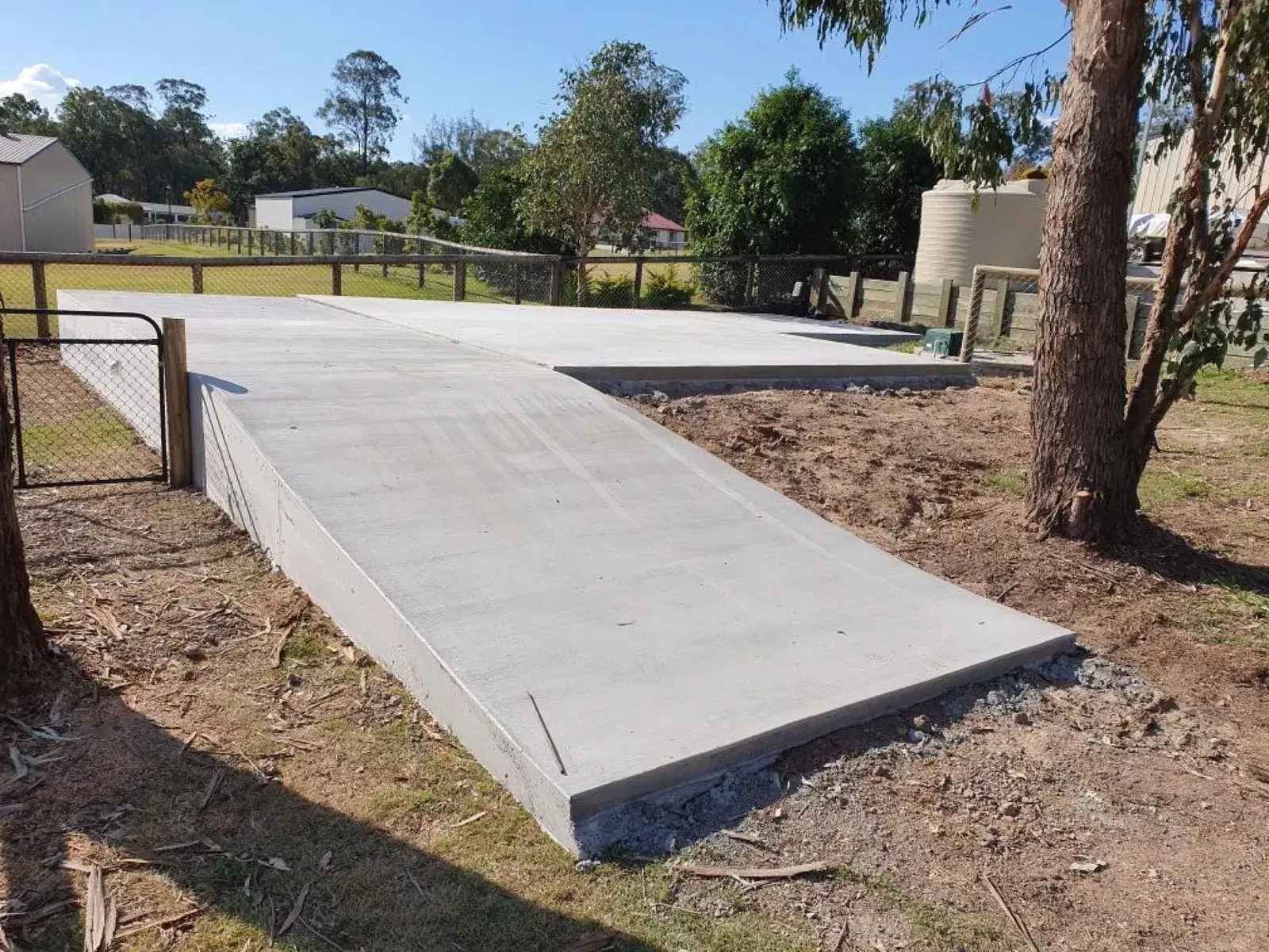 Concrete rural driveway access ramp on a large residential property