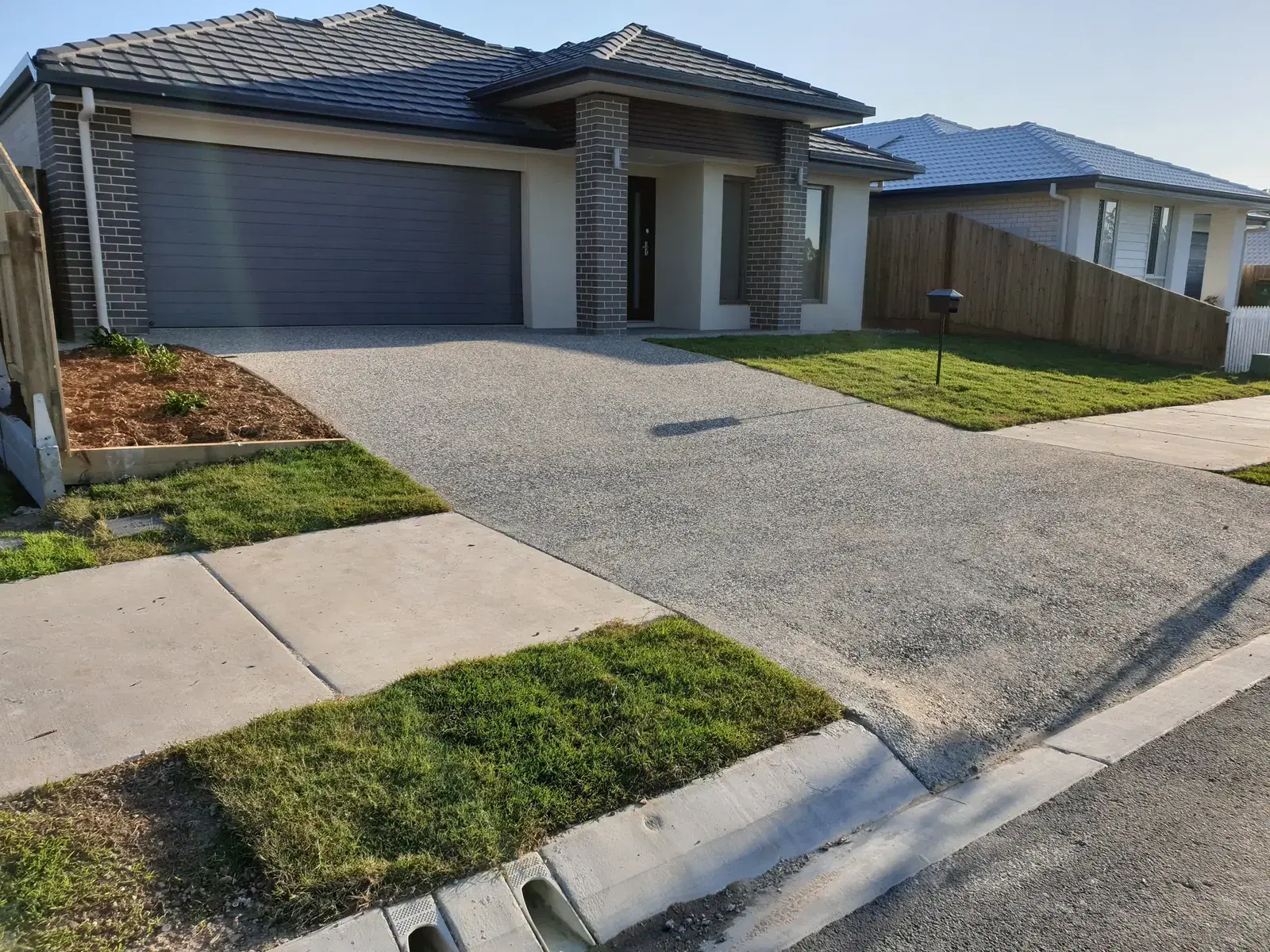 Exposed aggregate driveway project for concreters servicing Logan homes